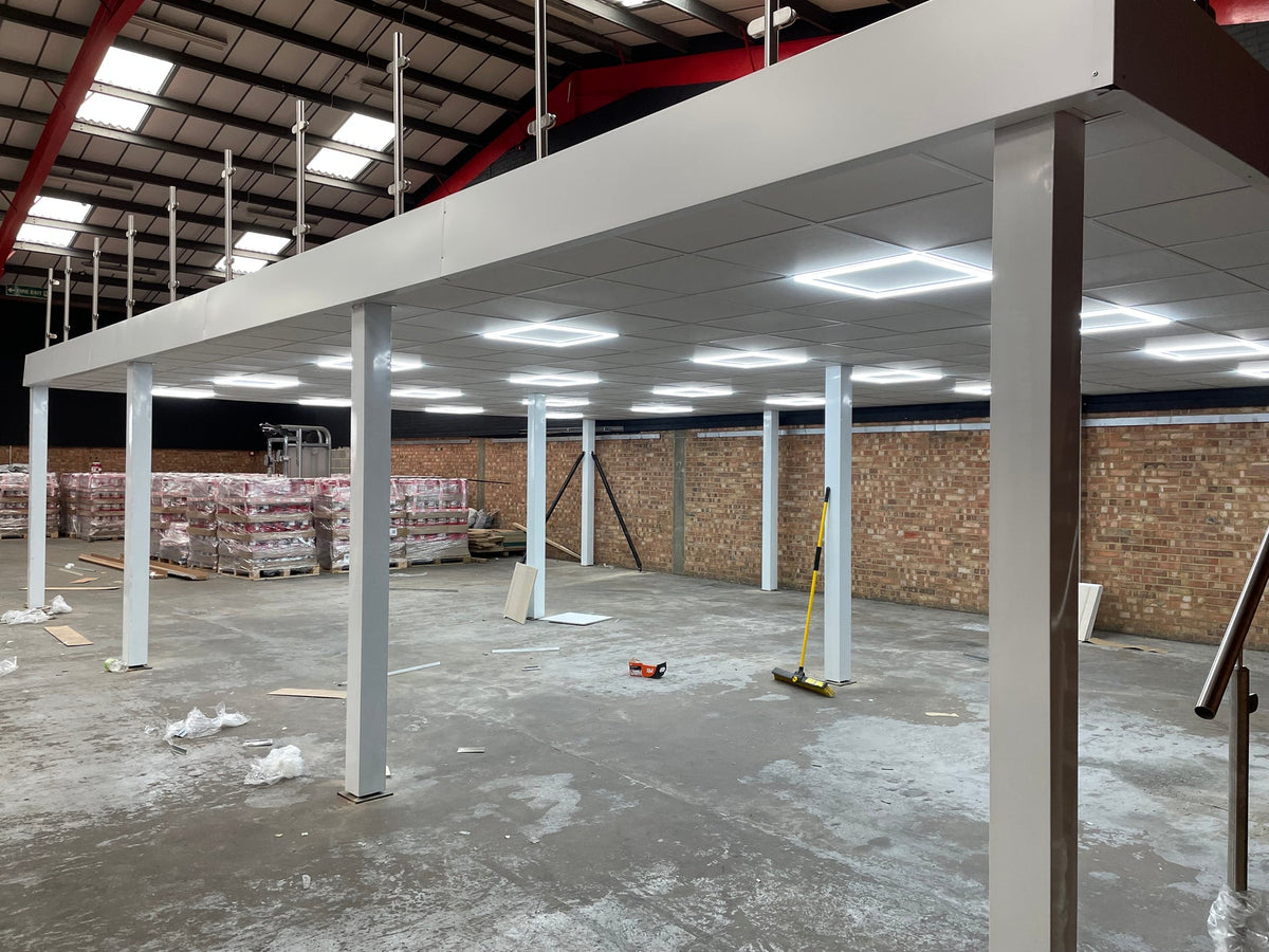 Suspended ceiling grid installation with recessed LED panels
